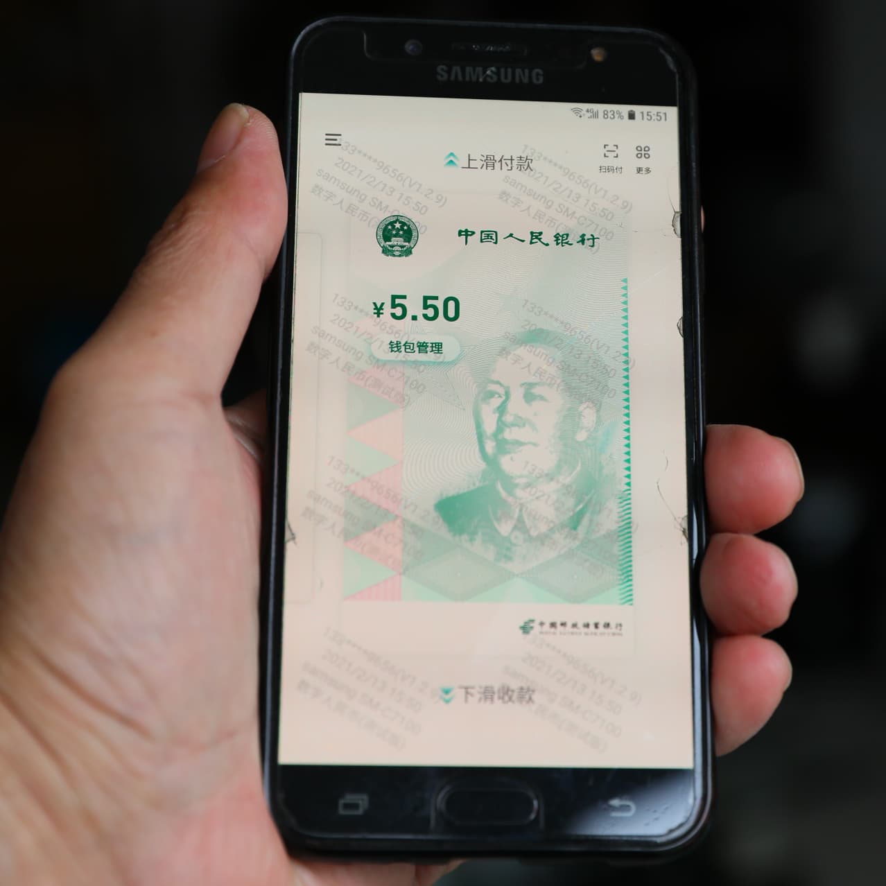 China's digital yuan transactions seeing strong momentum, says cbank gov Yi | Reuters