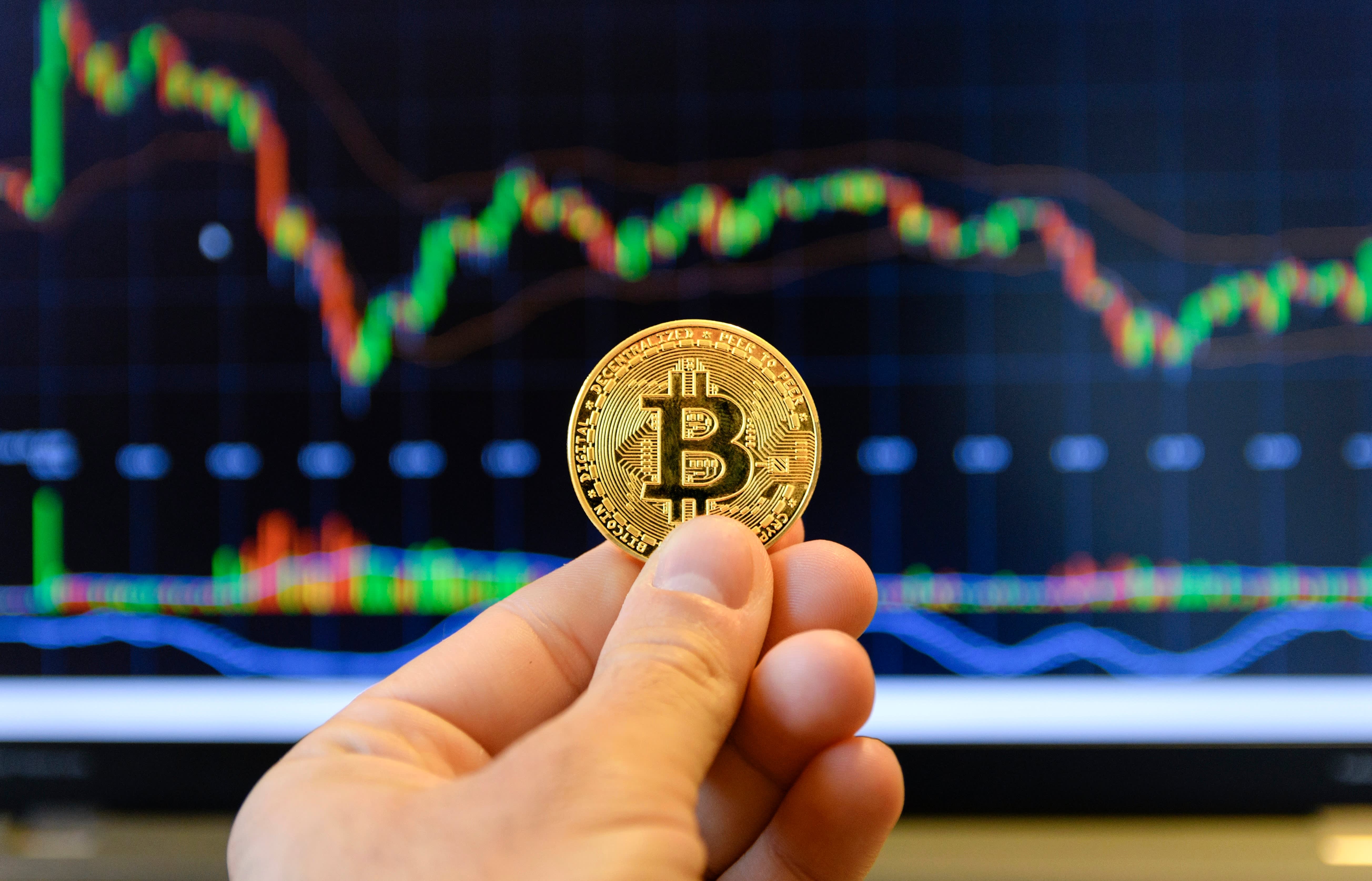 Bruised by stock market, Chinese rush into banned bitcoin | Reuters